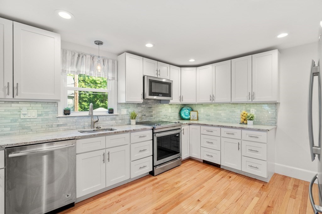 91 Fayette Street, Unit 91 Watertown, MA 02472 - Photo 9 of 21 a kitchen with sink cabinets and window