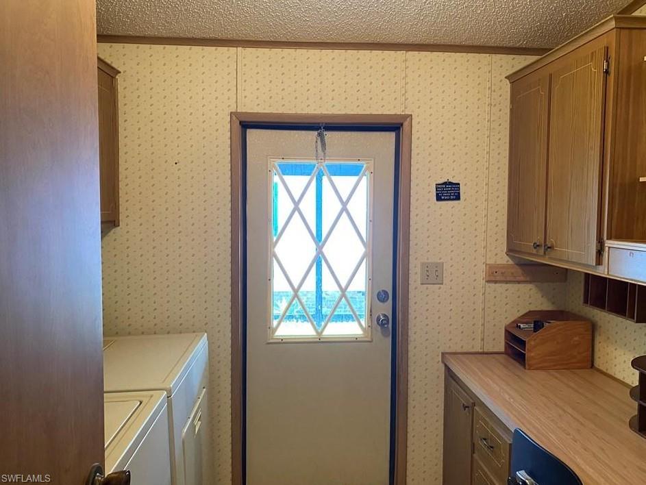 76 Atlantic Way, Unit 76 Naples, FL 34104 - Photo 11 of 18 a room that has a bed and a dresser in it