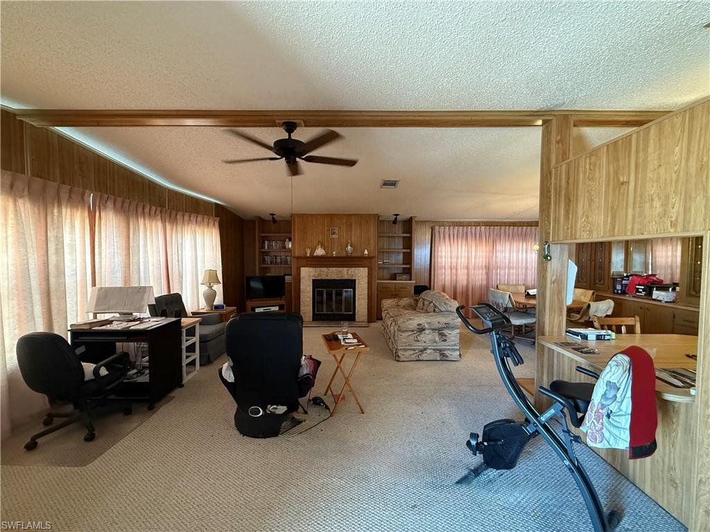 76 Atlantic Way, Unit 76 Naples, FL 34104 - Photo 16 of 18 a view of a livingroom with workspace and a window