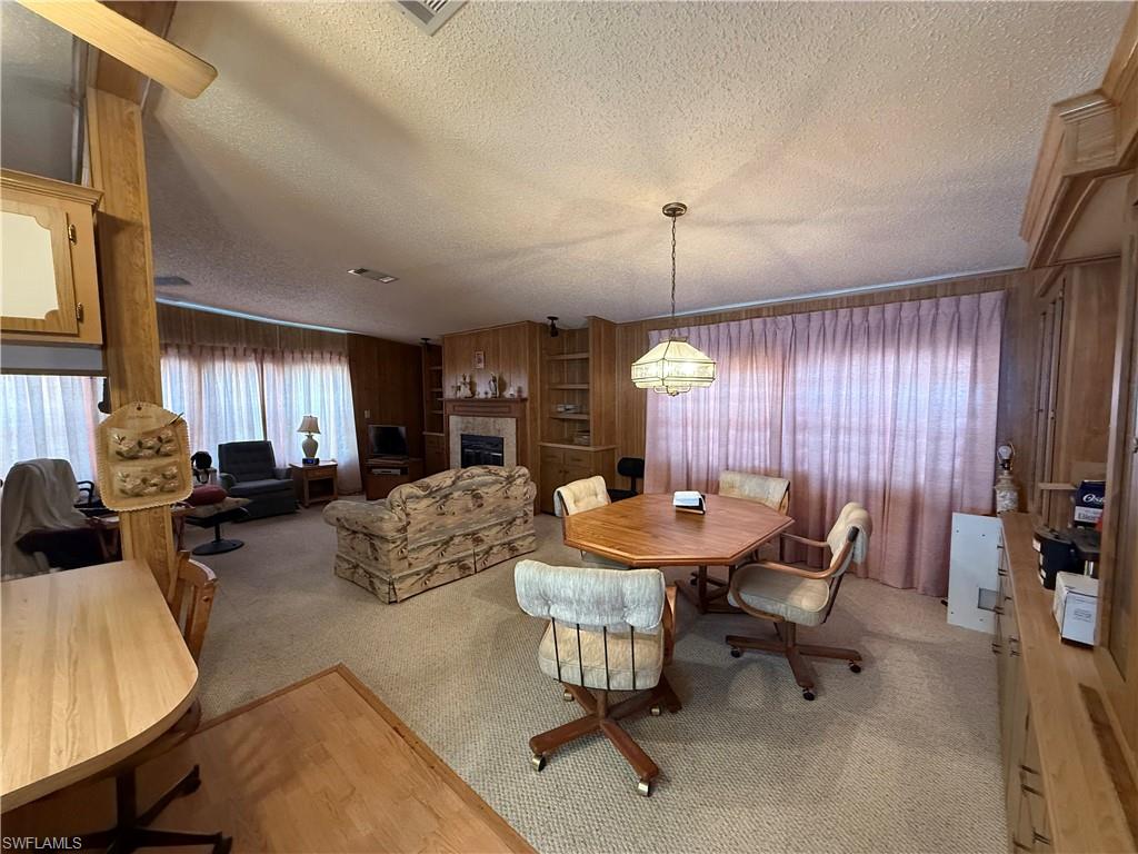 76 Atlantic Way, Unit 76 Naples, FL 34104 - Photo 18 of 18 a view of a dining room with furniture