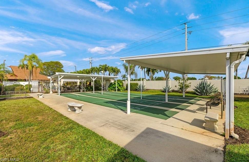 76 Atlantic Way, Unit 76 Naples, FL 34104 - Photo 7 of 18 a view of a house with a yard