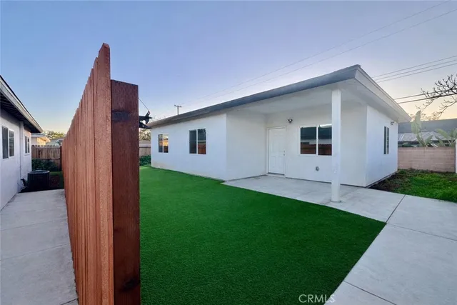 a backyard of a house with seating space