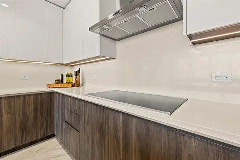 a living room with furniture a ceiling fan and a window