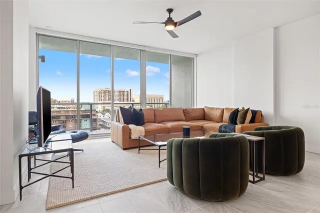 a living room with furniture kitchen view and a view of kitchen