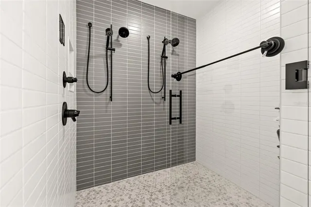 a bedroom with a bed and a television