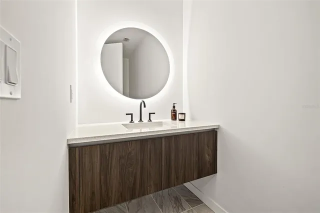 a very nice looking living room with a large window and furniture