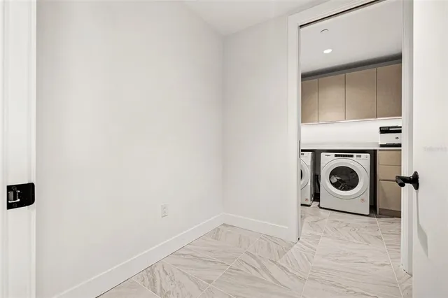 a view of a closet with wooden floor