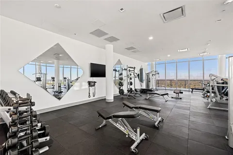 a view of a swimming pool with a lounge chair