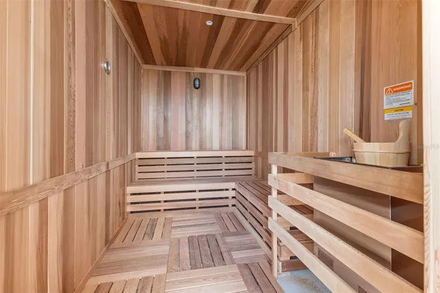 a bathroom with a bathtub and next to a window