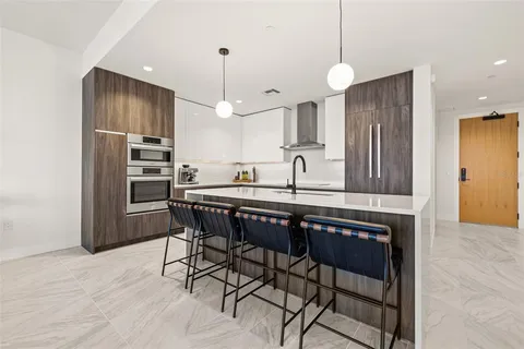 a kitchen with sink cabinets and window