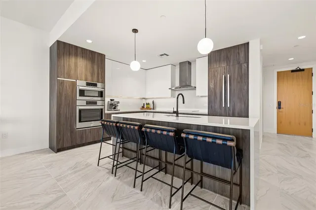 a kitchen with sink cabinets and window