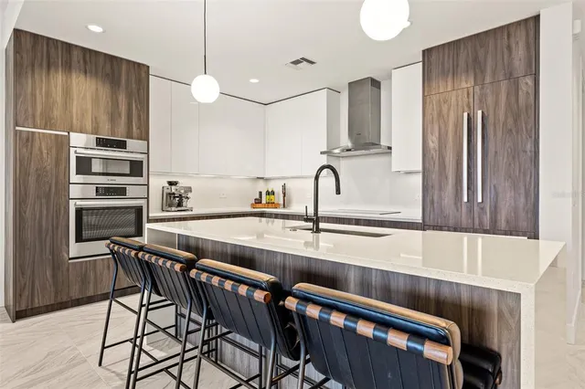 a kitchen with a table and chairs in it