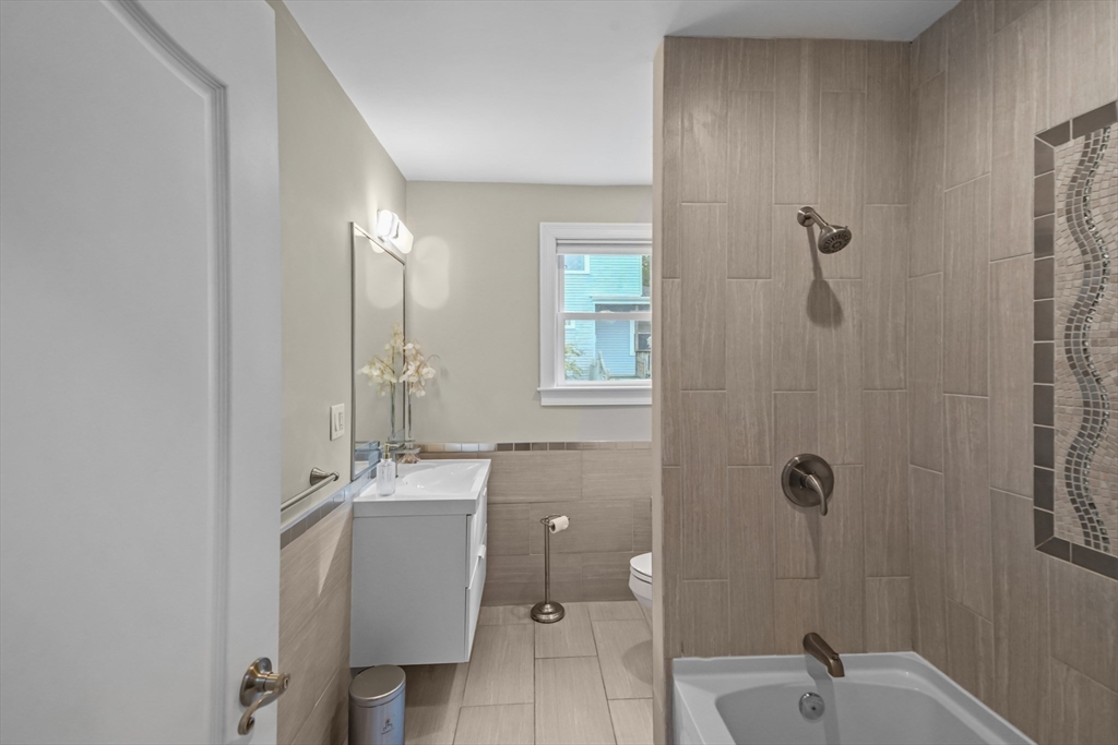 51 Faxon Street Braintree, MA 02184 - Photo 11 of 31 a bathroom with a sink toilet and shower