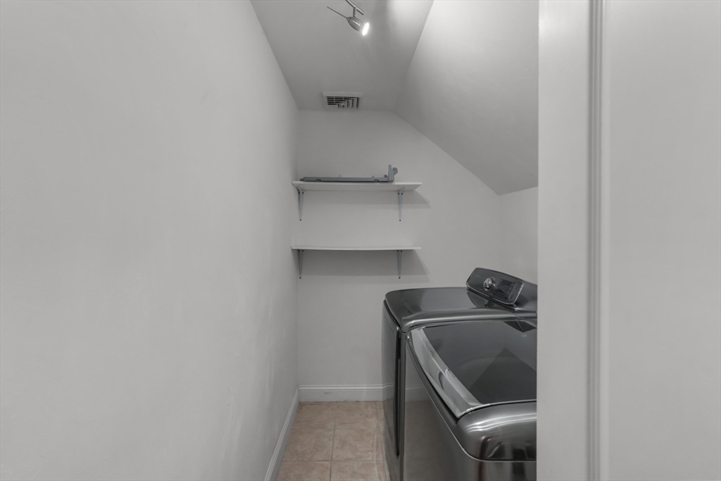 51 Faxon Street Braintree, MA 02184 - Photo 13 of 31 a bathroom with a sink and toilet