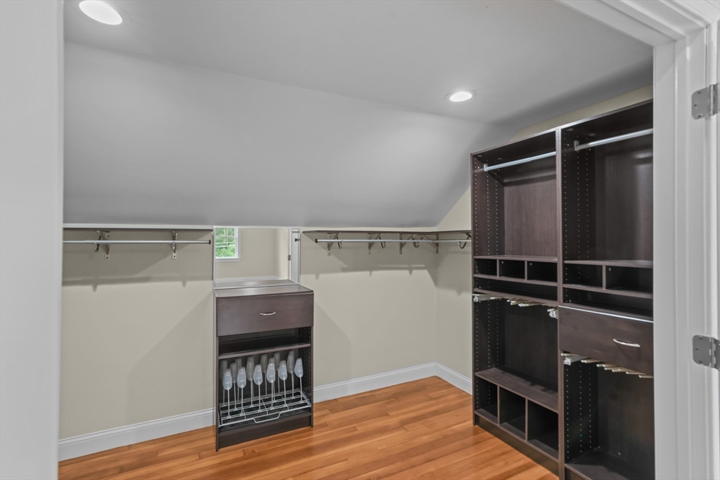 51 Faxon Street Braintree, MA 02184 - Photo 15 of 31 a view of walk in closet with clothes and shoes