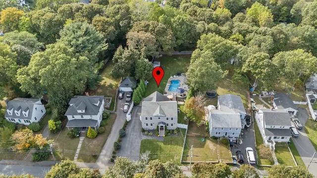 an aerial view of houses with yard