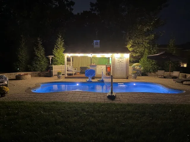 a view of swimming pool with an outdoor space and seating area