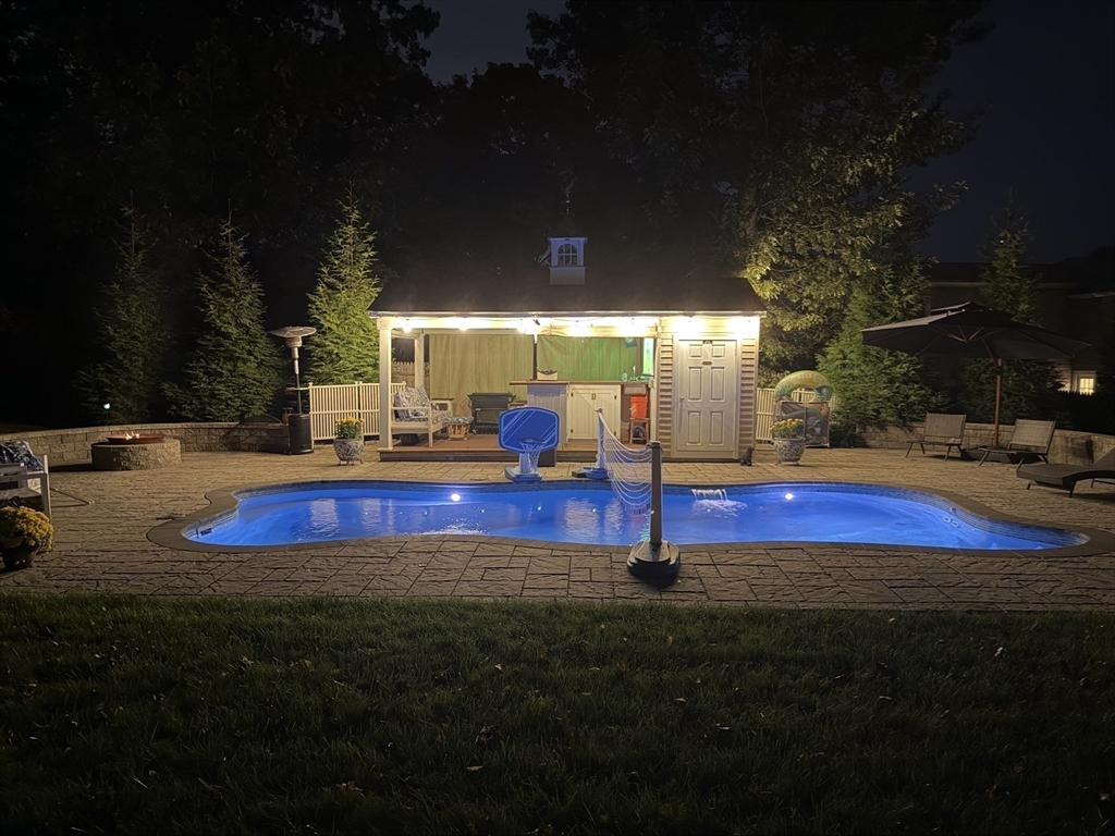 51 Faxon Street Braintree, MA 02184 - Photo 28 of 31 a view of swimming pool with an outdoor space and seating area