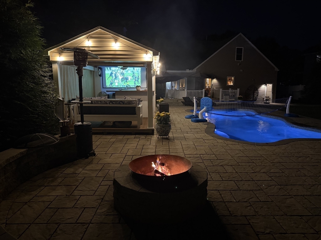 51 Faxon Street Braintree, MA 02184 - Photo 29 of 31 a living room with furniture and a fireplace