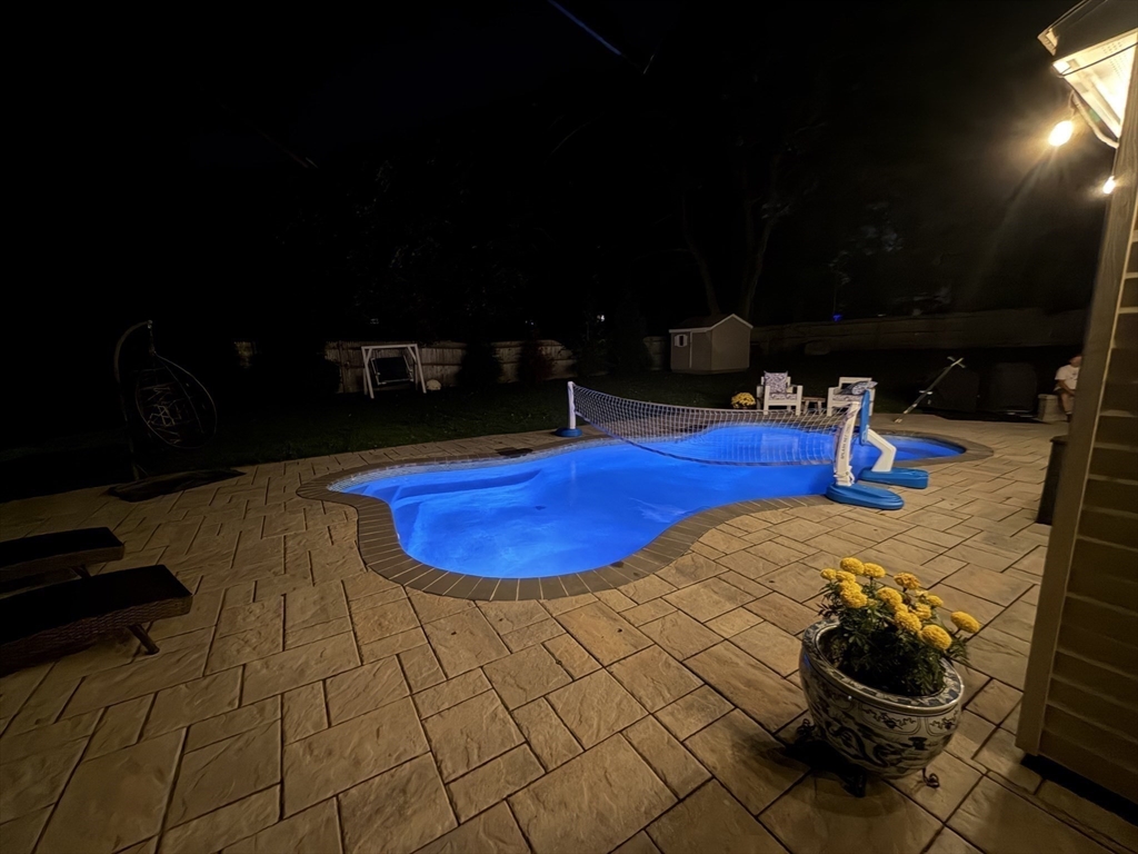 51 Faxon Street Braintree, MA 02184 - Photo 31 of 31 a view of a swimming pool with seating space