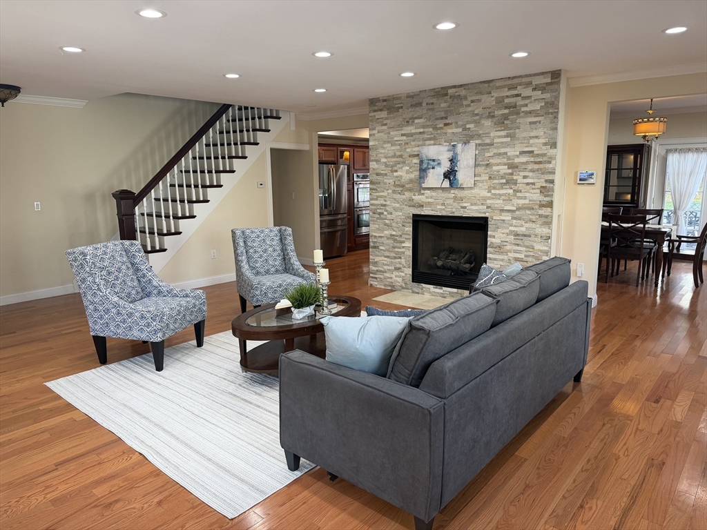 51 Faxon Street Braintree, MA 02184 - Photo 4 of 31 a living room with furniture and a fireplace