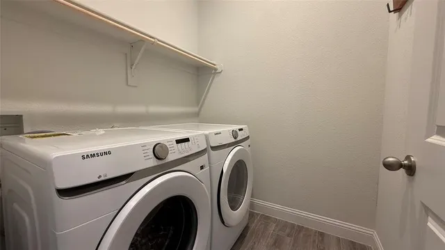 a utility room with dryer and washer