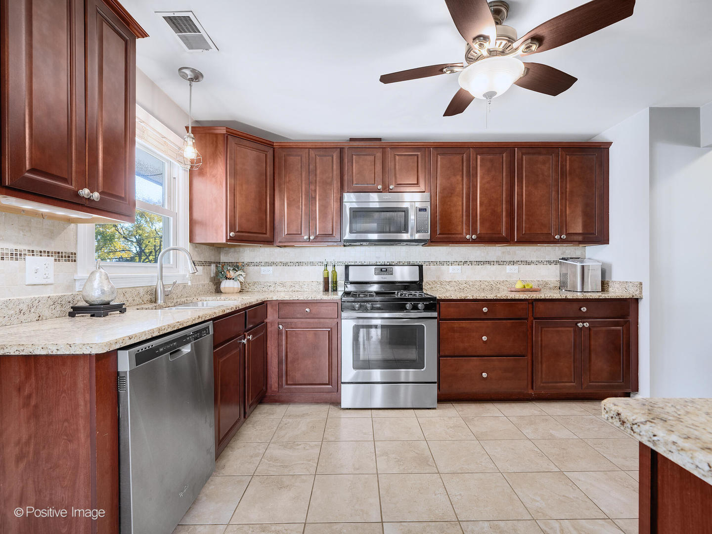 1517 Sequoia Lane Darien, IL 60561 - Photo 12 of 27 a kitchen with stainless steel appliances granite countertop a stove sink and cabinets