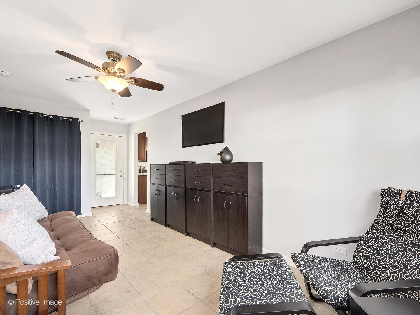 1517 Sequoia Lane Darien, IL 60561 - Photo 20 of 27 a bedroom with a bed and a flat screen tv