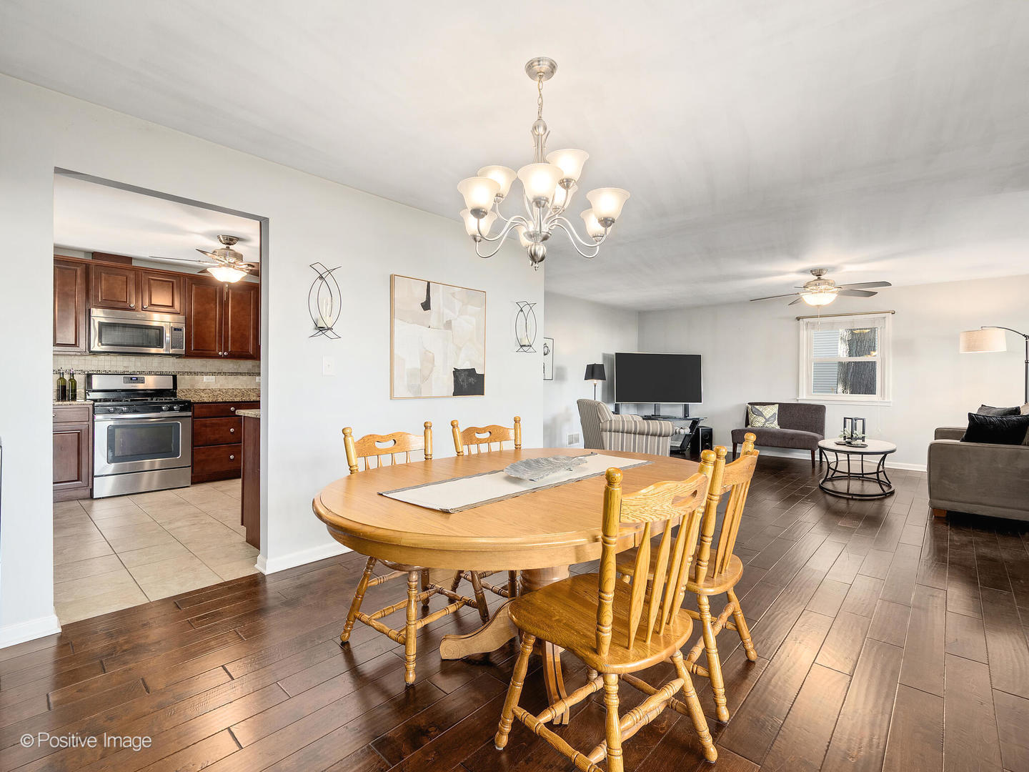 1517 Sequoia Lane Darien, IL 60561 - Photo 7 of 27 a view of a dining room with furniture and wooden floor