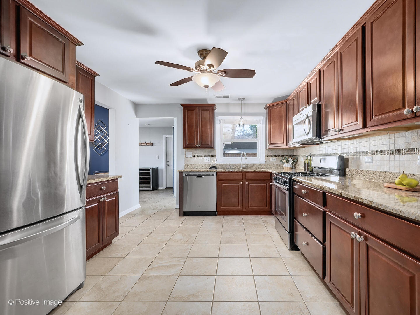 1517 Sequoia Lane Darien, IL 60561 - Photo 10 of 27 a kitchen with stainless steel appliances granite countertop a refrigerator a sink a stove top oven and cabinets