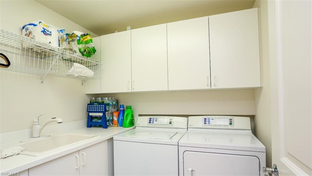 1060 Borghese Lane, Unit 603 Naples, FL 34114 - Photo 45 of 50 Clothes washing area featuring a sink, cabinet space, and washer and dryer