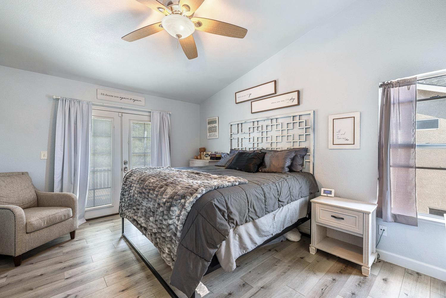 3232 Greenfield Avenue Clovis, CA 93611 - Photo 21 of 38 a spacious bedroom with a bed and a couch