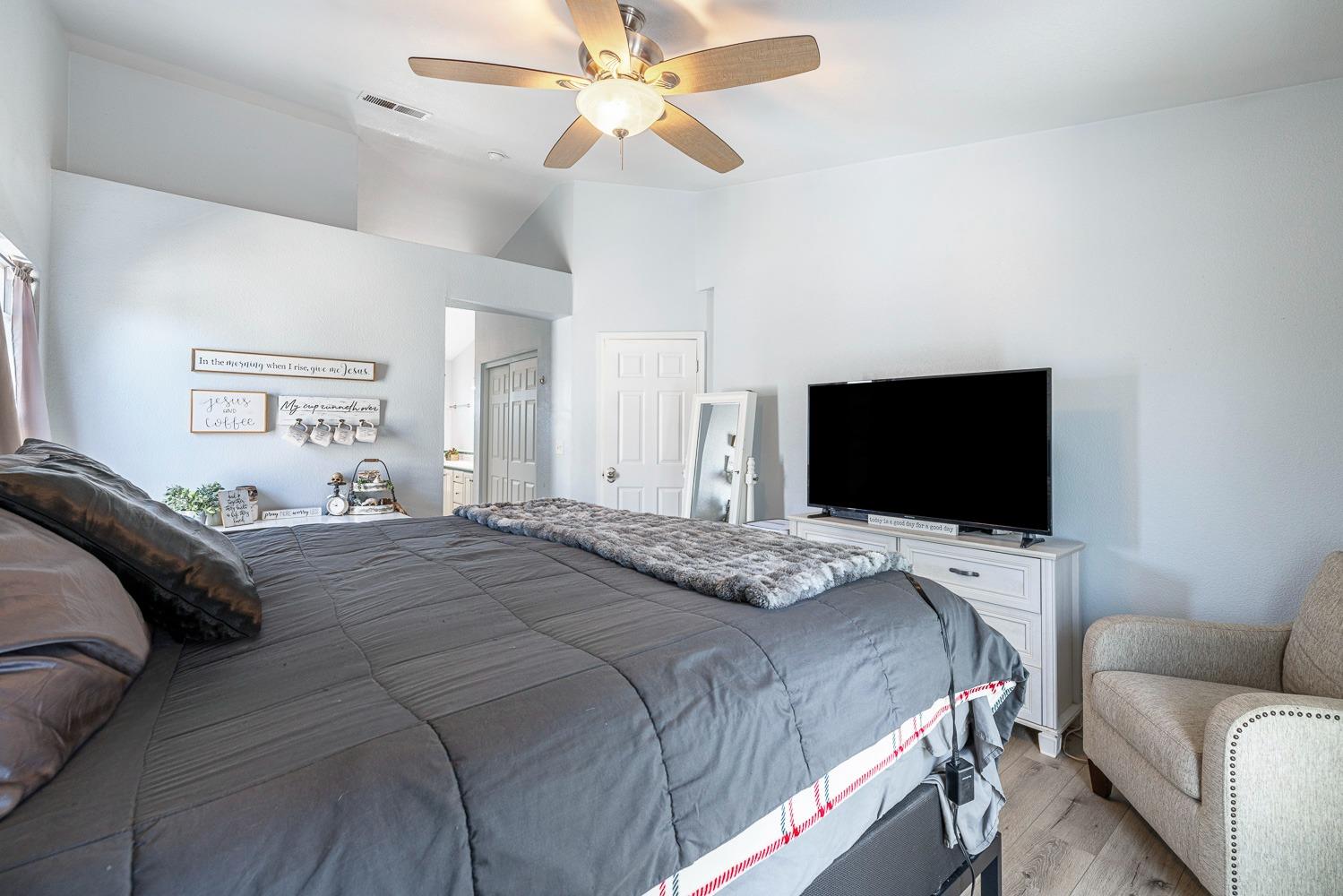 3232 Greenfield Avenue Clovis, CA 93611 - Photo 22 of 38 a bedroom with a bed and a flat screen tv