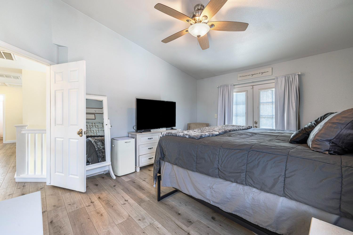 3232 Greenfield Avenue Clovis, CA 93611 - Photo 24 of 38 a bedroom with a bed and a flat screen tv