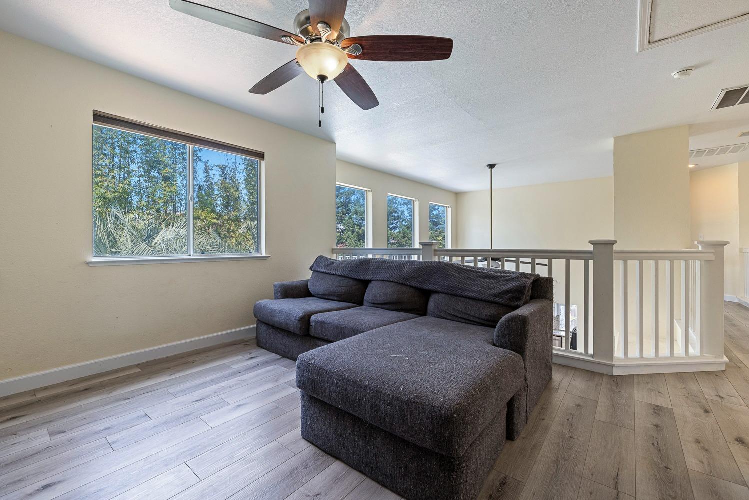 3232 Greenfield Avenue Clovis, CA 93611 - Photo 28 of 38 a living room with furniture and a window