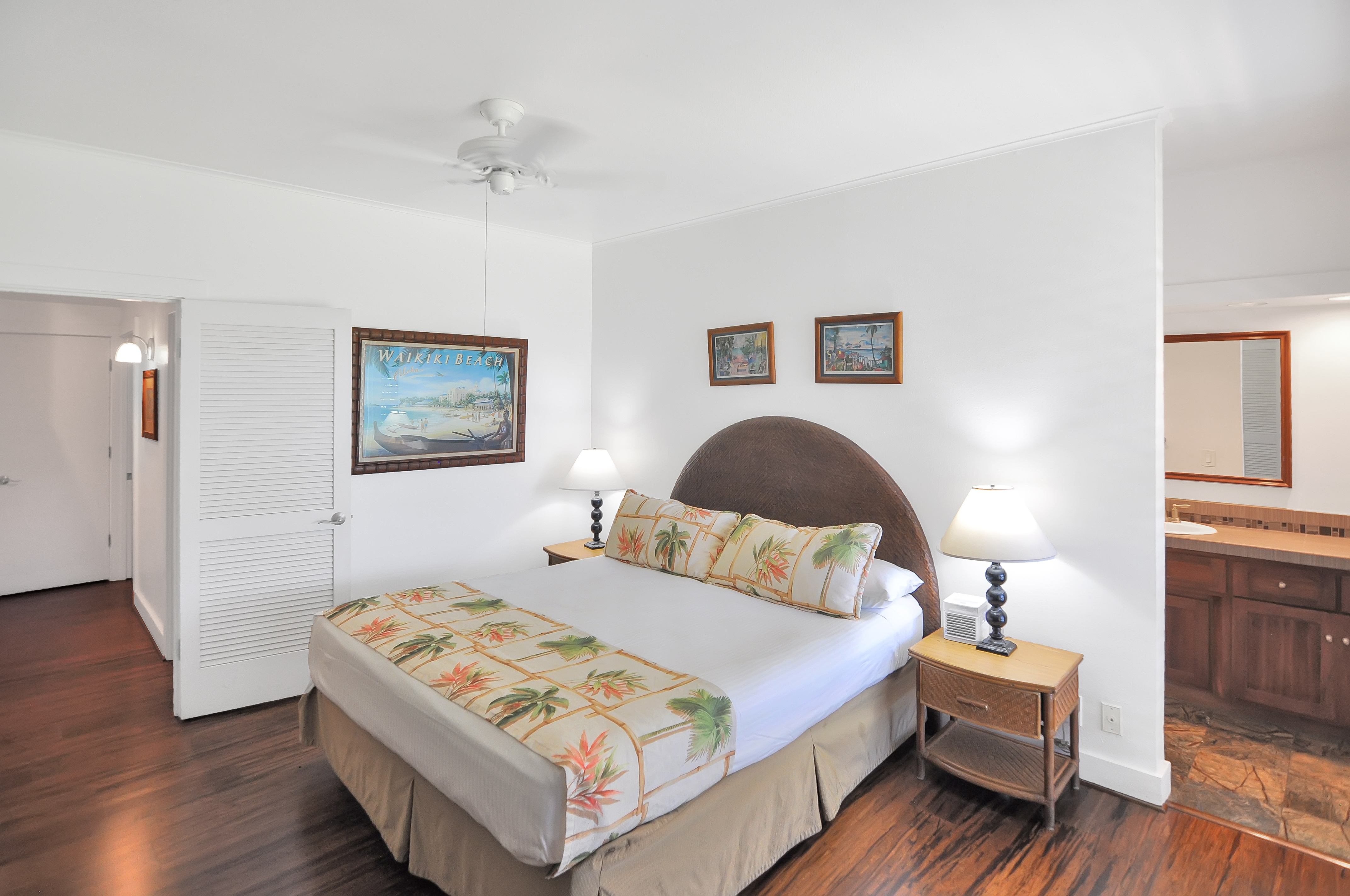 2253 Poipu Road, Unit 244 Koloa, HI 96756 - Photo 11 of 20 a bedroom with a bed and a lamp
