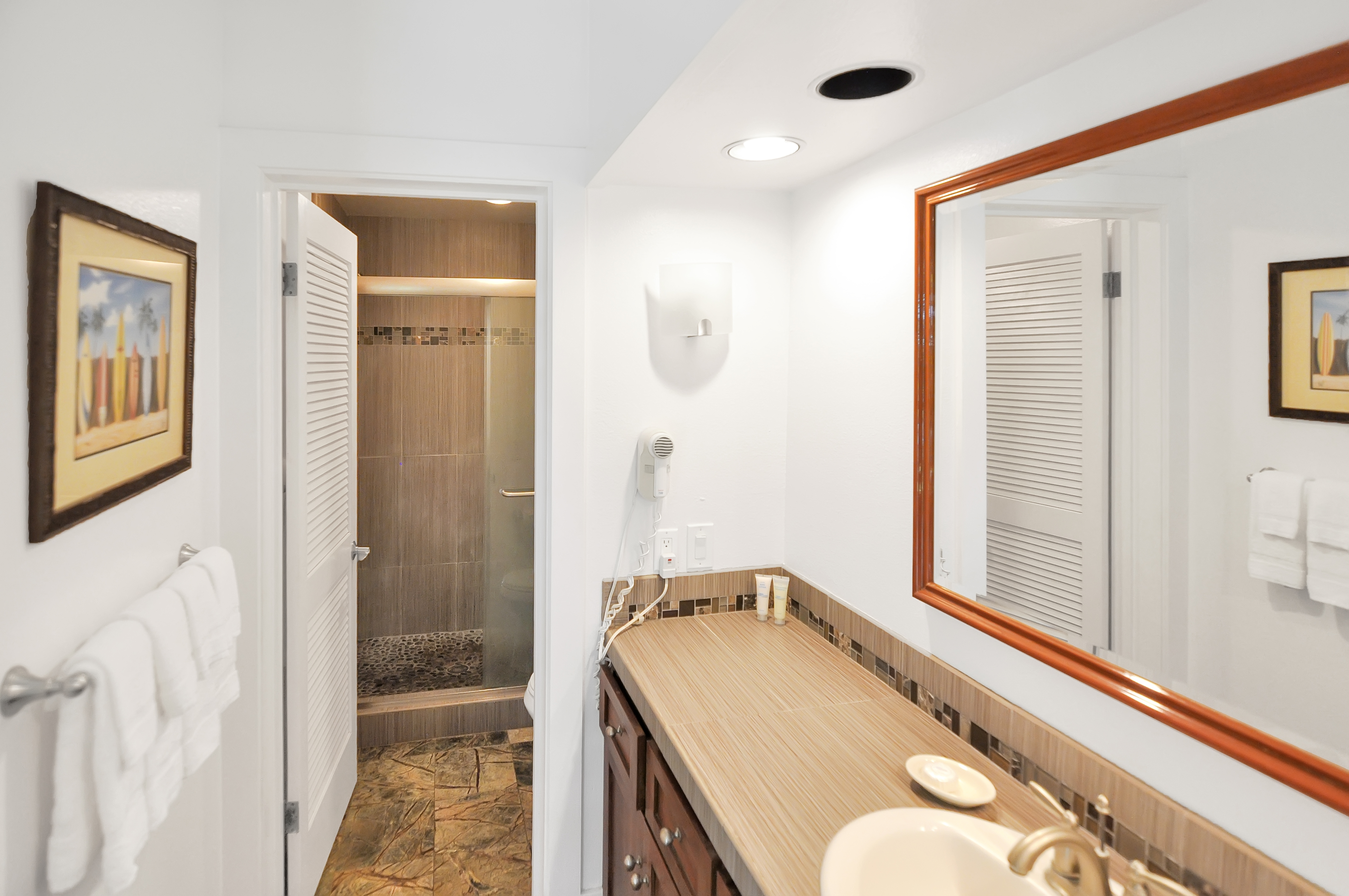 2253 Poipu Road, Unit 244 Koloa, HI 96756 - Photo 13 of 20 a bathroom with a granite countertop sink and a mirror
