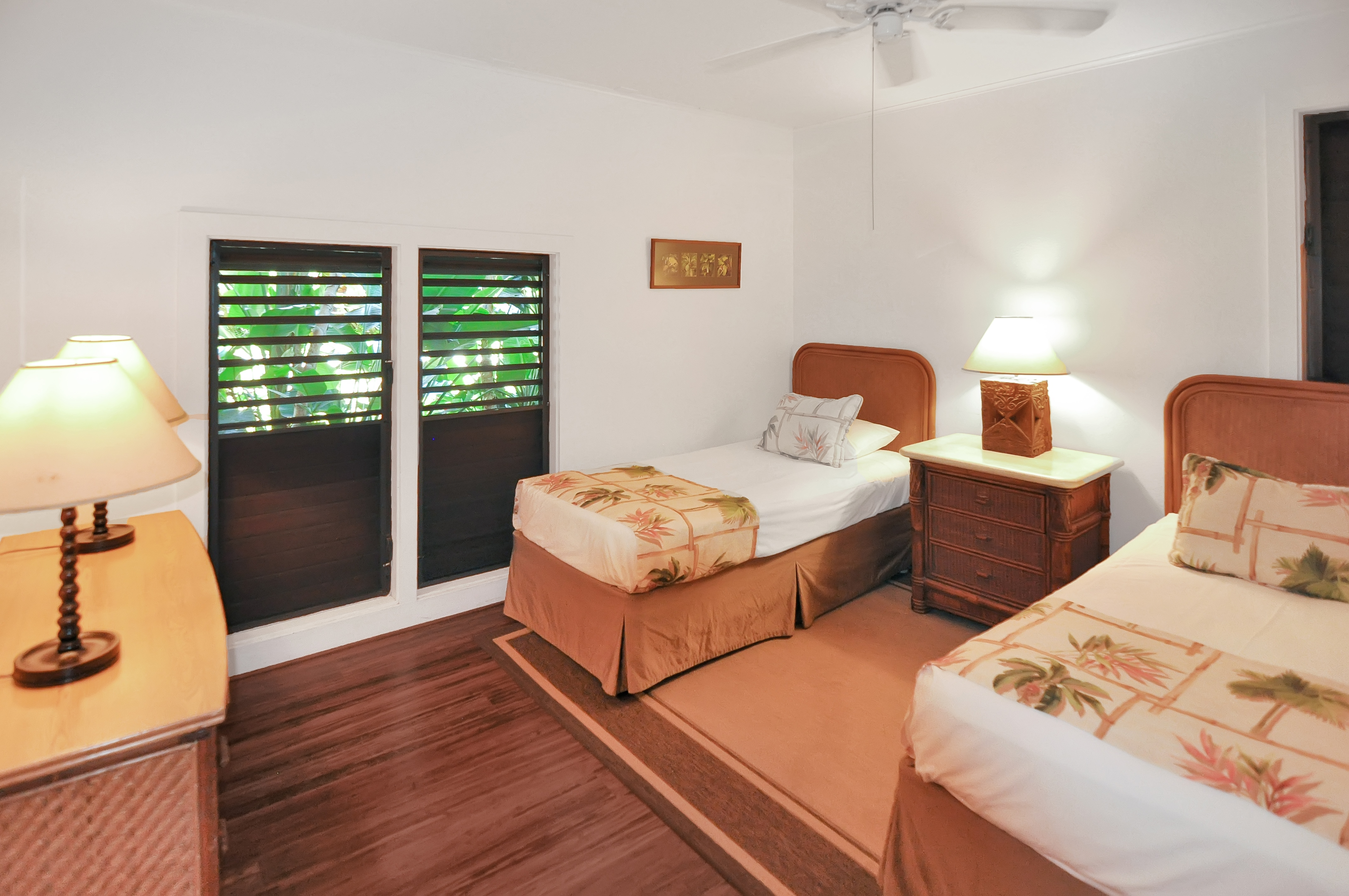 2253 Poipu Road, Unit 244 Koloa, HI 96756 - Photo 16 of 20 a bedroom with two beds and painting on the wall