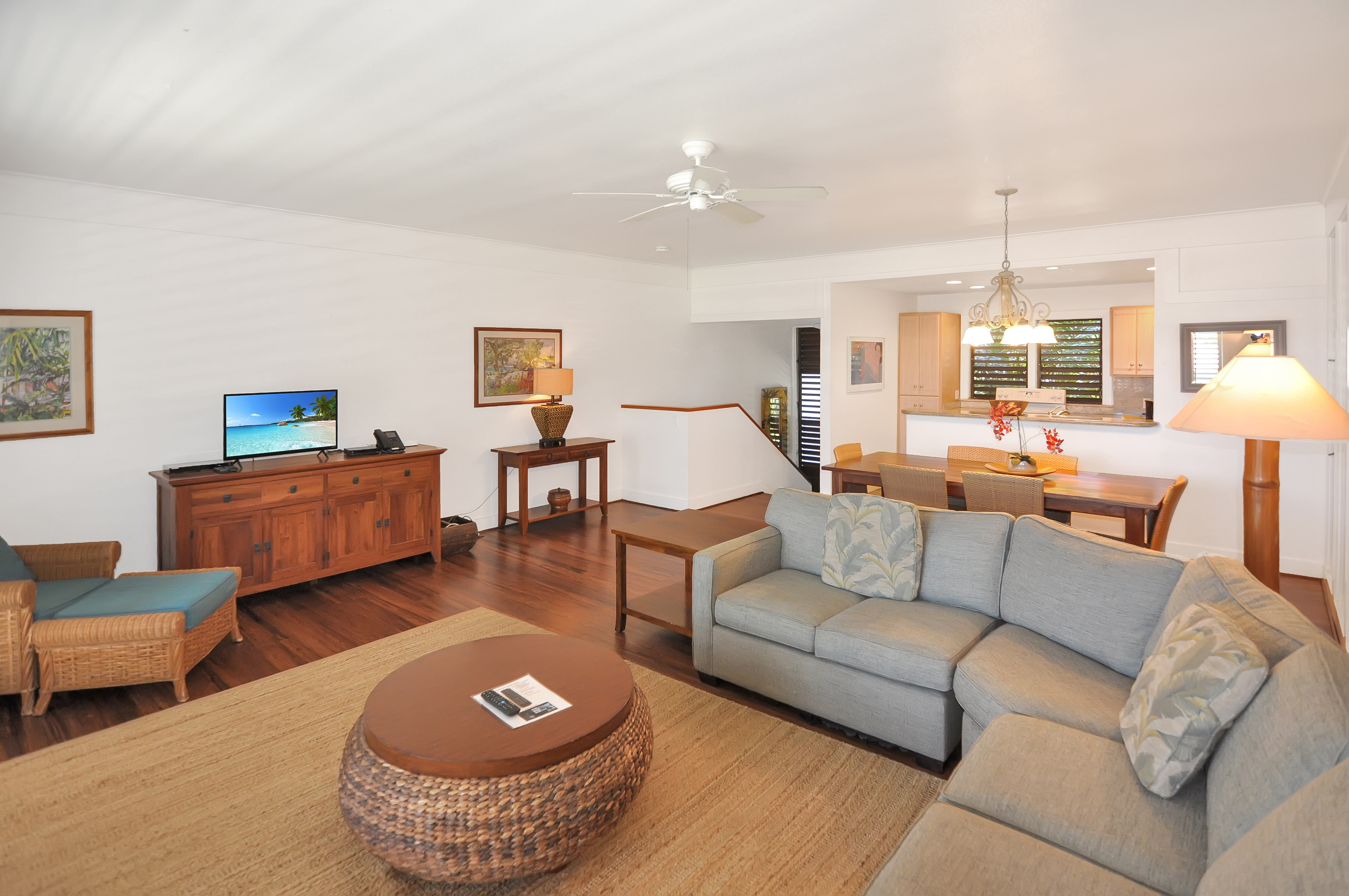 2253 Poipu Road, Unit 244 Koloa, HI 96756 - Photo 2 of 20 a living room with furniture and a lamp