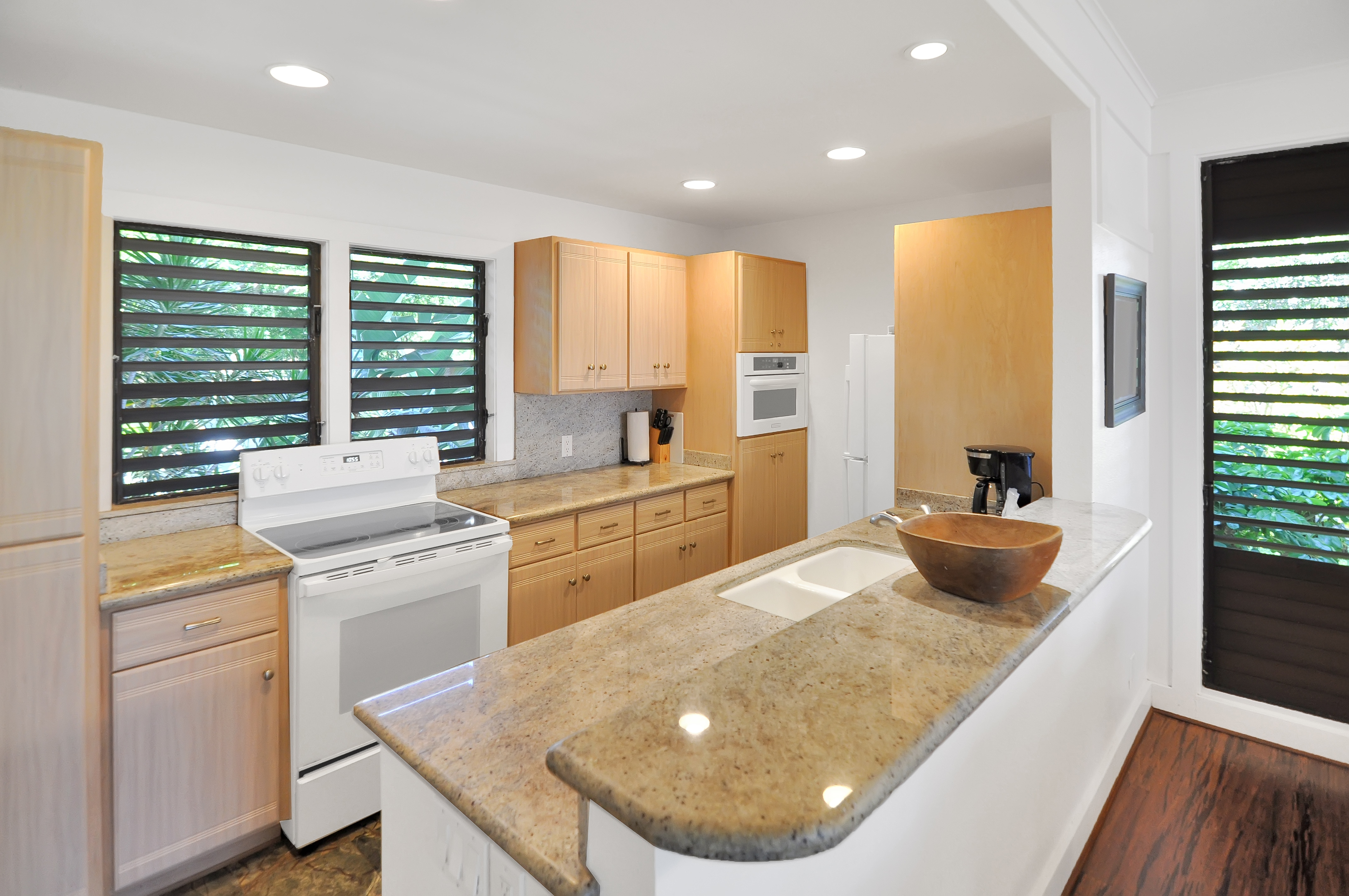 2253 Poipu Road, Unit 244 Koloa, HI 96756 - Photo 4 of 20 a kitchen with a stove a sink a refrigerator and a window