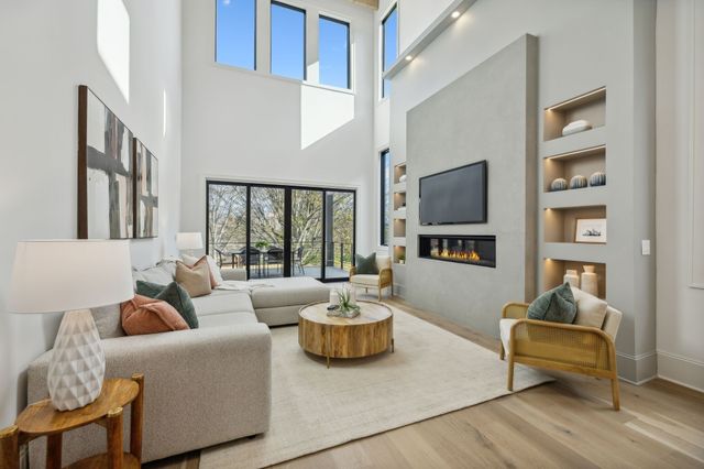 a kitchen with stainless steel appliances a refrigerator and cabinets