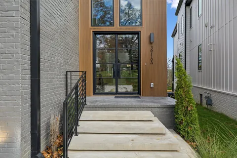 an outdoor space with patio and white umbrellas