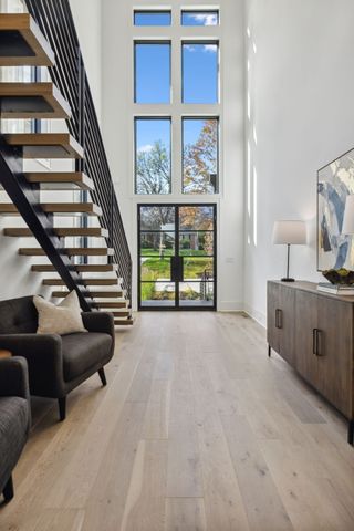 a kitchen with stainless steel appliances granite countertop a sink and a refrigerator