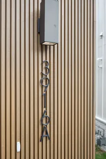 a open kitchen with a sink a window and stainless steel appliances