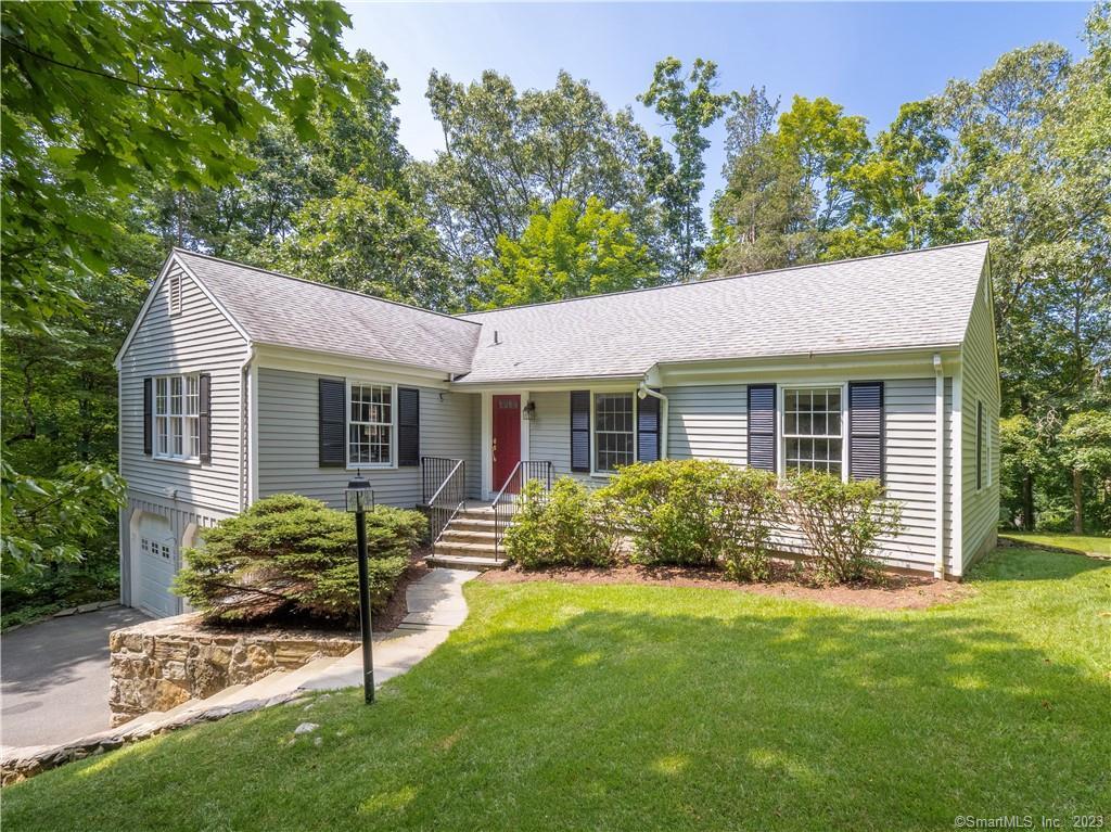 21 Pocconock Trail Ridgefield, CT 06877 - Photo 1 of 1 a view of a house with a yard and plants