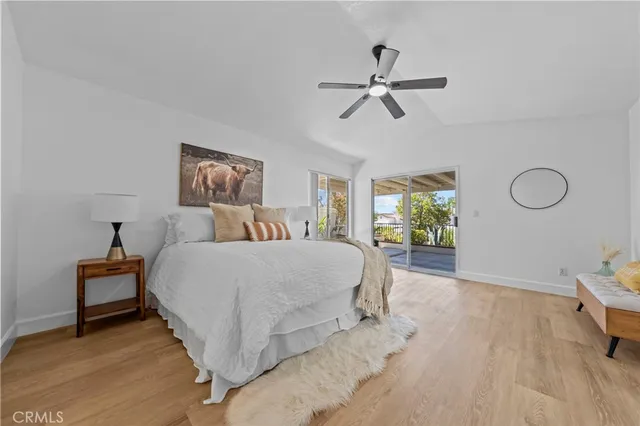 a spacious bedroom with a bed and window