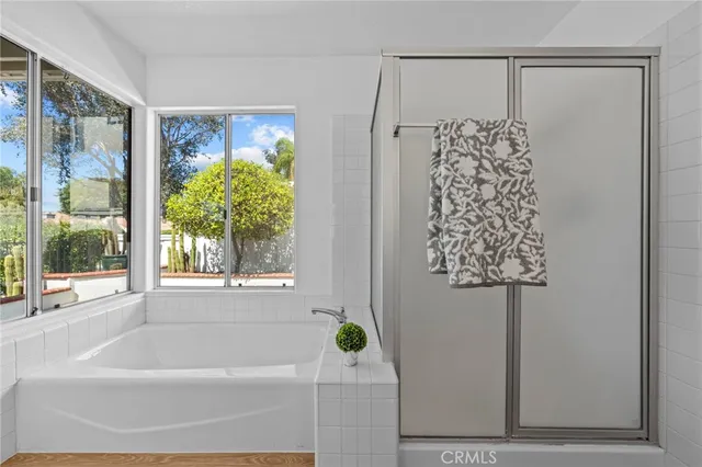 a bathroom with a shower curtain and a window
