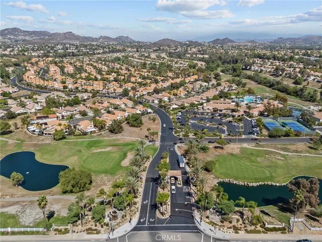 an aerial view of a residential houses with outdoor space
