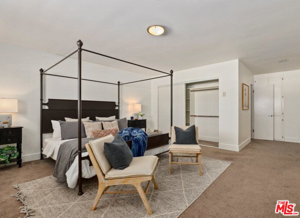 6624 South Springpark Avenue, Unit 5A Los Angeles, CA 90056 - Photo 14 of 23 a living room with furniture a lamp and a potted plant