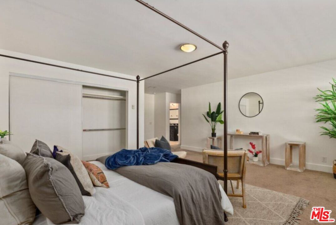 6624 South Springpark Avenue, Unit 5A Los Angeles, CA 90056 - Photo 15 of 23 a bed room with a bed and a mirror